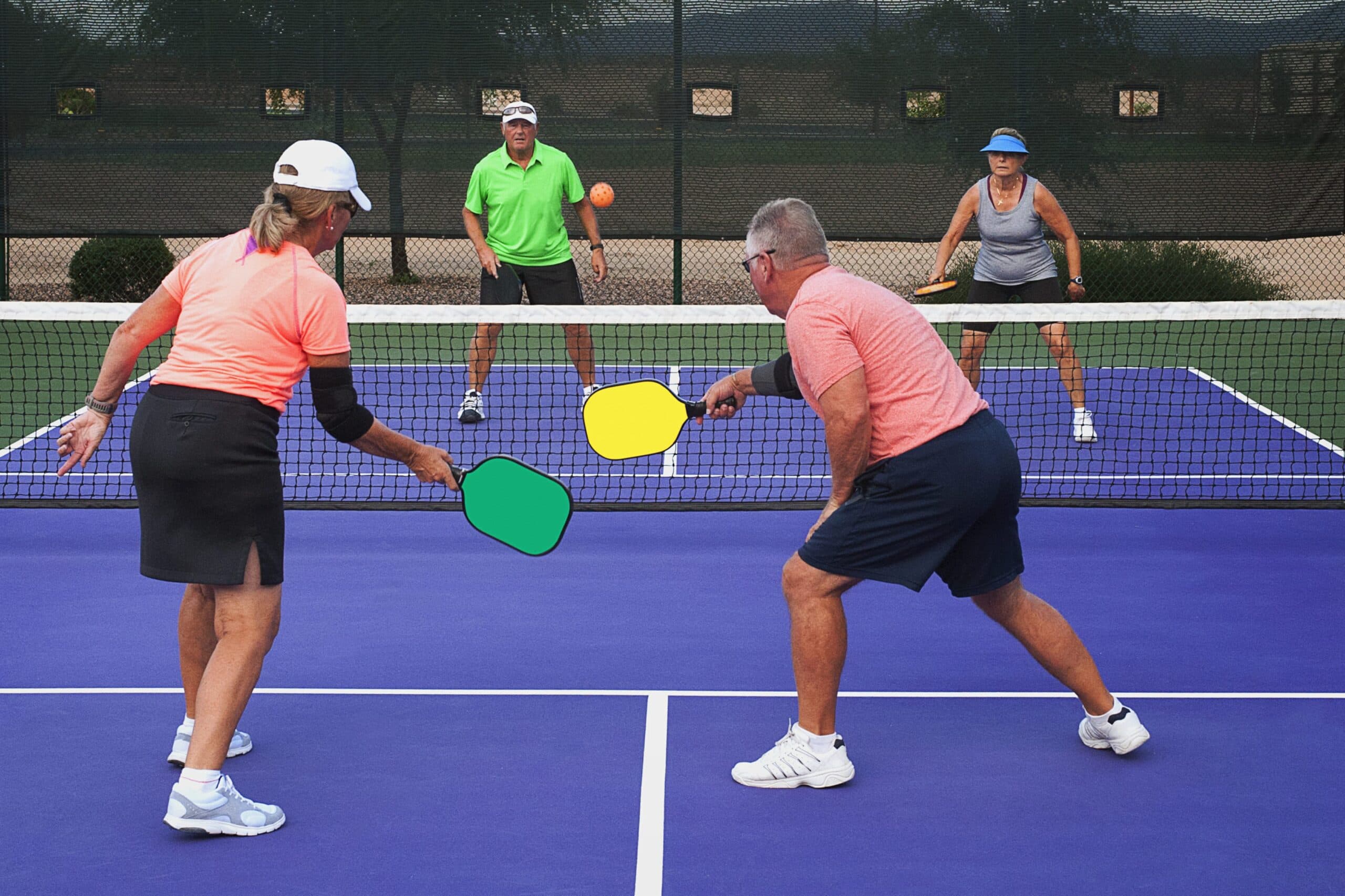Active adults playing pickleball
